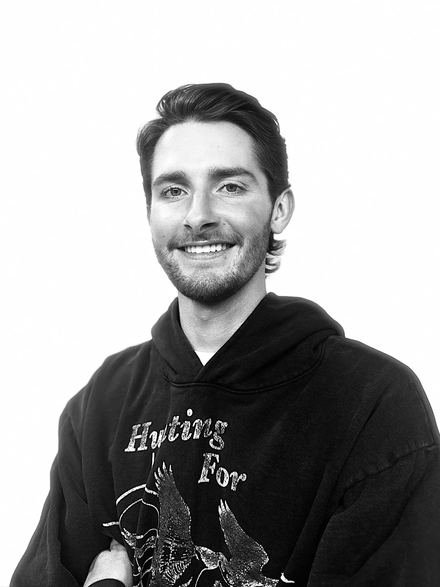 Headshot of Adley Prescott, barber and stylist with The Bureau Barbershop in Salt Lake City.